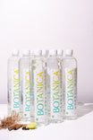 Bottles of Botanica herbal water on a white background